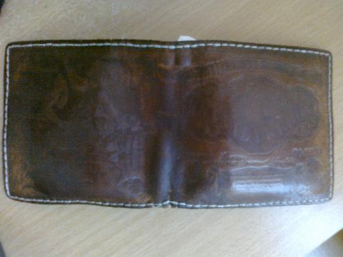 This is my wallet. - This is my wallet, it is a quite rare one here in Estonia. It has a picture of an Estonian banknote that has been in use back in the 20th century. It is a handmade leather wallet, about 20 years old.