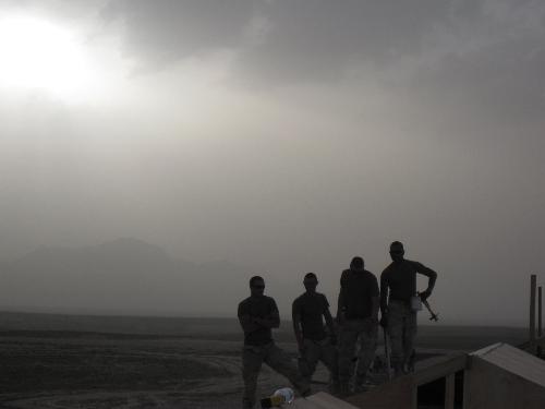 We are seabees - This is a photo of my friends in afghanistan. This picture was taken after a duststorm and we finished building a seahut. We are seabees after all