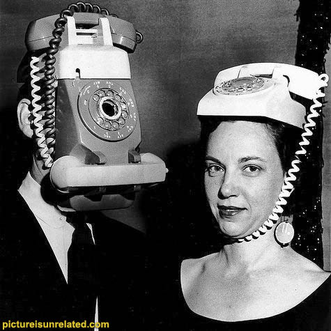 Telephone Hats - 50s-60s most likely, black and white, a man and a woman wearing telephones on their heads. What more can I say?