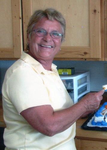 Peggy - Peggy cutting cake at her 60th birthday party