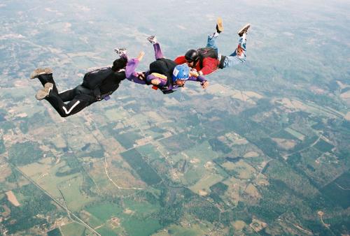 Me skidiving in 2002 - Oh yes that is me in the middle, skydiving from 14,000 feet over the Georgia Sky Diving Center drop zone