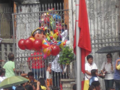 balloons - balloons sold by a vendor in a busy place