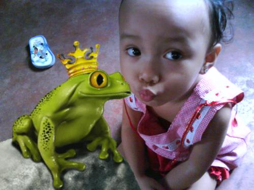my sweetie - my 3 year old daughter wishing to make the frog turn into a handsome prince hehe