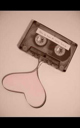 Love songs and a cassette - A cassette with heart sign using it&#039;s tape.