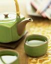 Green Tea - Green tea tea pot next to a cup of yummy green tea. :)