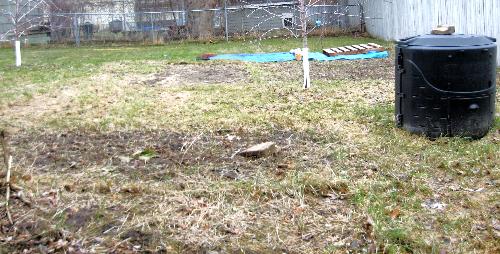 Garden Bed - One of my garden beds with a new area covered with a tarp till the ground thaws more. Garden Bed - One of my garden beds with a new area covered with a tarp till the ground thaws more.