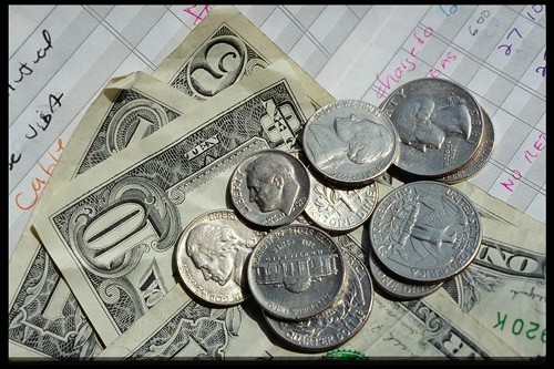 Cash - Everyone is looking for ways to earn cash online. There are various methods, but not all work. This photo is of a few dollars in cents and paper cash.