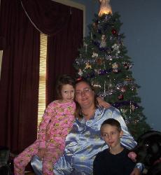 christmas - Last Christmas in front of our Christmas tree. Their is my daughter, son and myself. 