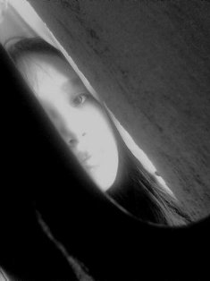Grey - This can be considered a self-shot photo. The dark slightly arched object is a part of my violin that was hanging on the wall.This photo was taken two years ago.