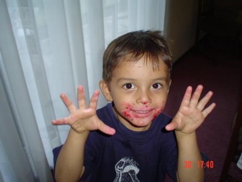 Diego eating all sorts of junk food - I took this picture of my grandson Diego a couple of years ago. He came for a visit with his whole face red from some red food dye. Içm sure that is not healthy. I took a picture of him and then gave my daughter a piece of my mind.