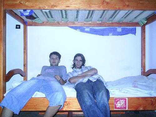 Me and my roommate - This is taken in my room. In my bed. It is me and a good friend of mine.