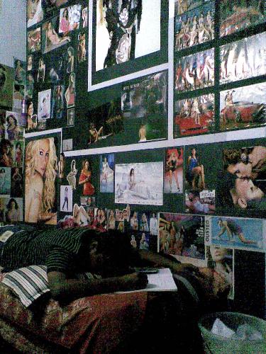 my friend's room, full of posters :) - My friend, i guess he fantasizes a lot lol, that is me over there, pretending to study :P