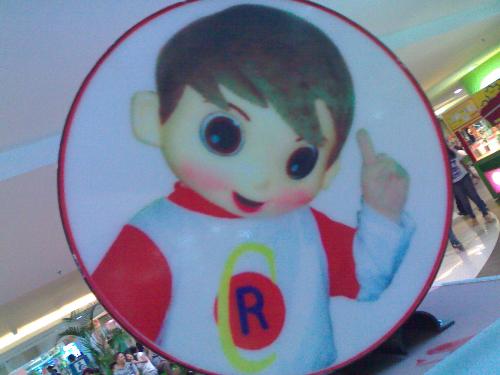 cute mascot boy - this was taken at the mall when we were strolling around.. we found it cute that's why we took a picture of it.. it's a mascot..a poster of a stall..