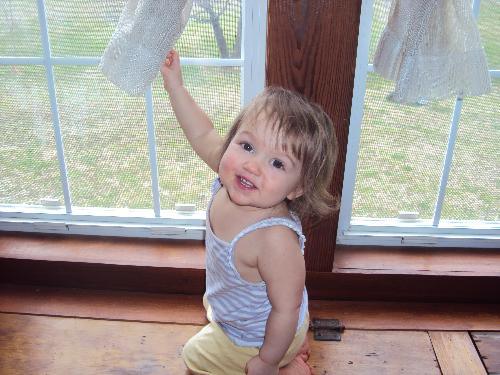 Kylie Ann 14 Months - Kylie Ann playing on the window seats.
