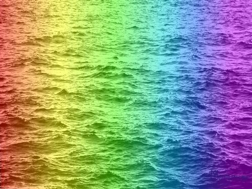 Rainbocean - Rainbow coloured ocean. View of an ocean's water coloured in red, orange, green, blue, violet to give a rainbow impression.