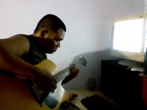 my hubby - My husband was playing guitar.