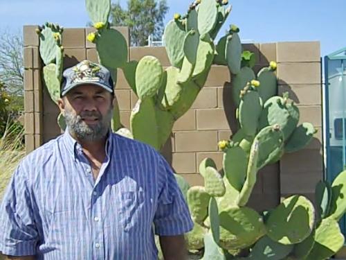 My big cactus  - Here's a picture of me and my 12 foot cactus and is blooming now