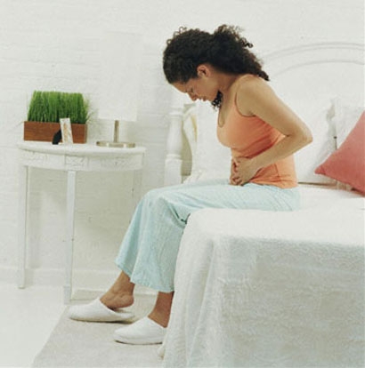 Dysmenorrhea - A woman suffering from dysmenorrhea or menstrual cramps. PAINFUL :(
