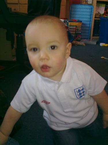 My Youngest - A pic of my little man on his 1st birthday wearing his new england shirt that daddy bought him!
