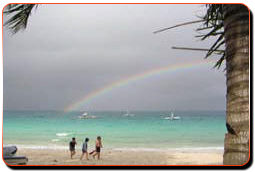 enjoying the beach,with a lovely rainbow - beach; who wouldn't want to go to a place really relaxing like this!