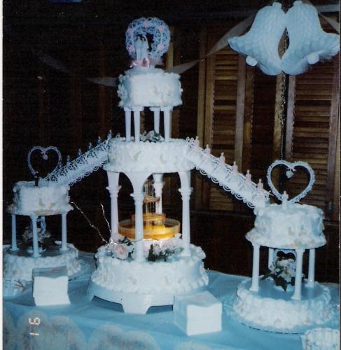 wedding cake - tierd with side cakes and stairs