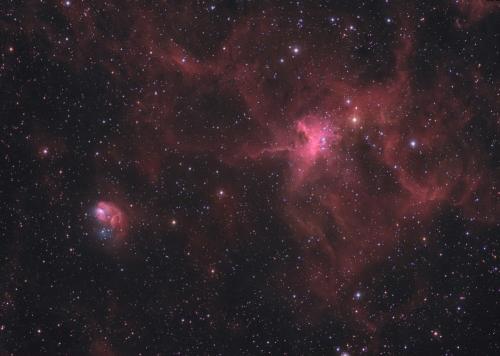 Star clusters and nebulae abound in the ancient no - Star clusters and nebulae abound in the ancient northern constellation Auriga - a region that includes the interesting pair NGC 1931 (lower left) and IC 417. In this gorgeous color image, an imaginative eye toward the expansive IC 417 and diminutive NGC 1931 suggests a cosmic spider and fly. About 10,000 light-years distant, both are young open star clusters formed in interstellar clouds and still embedded in glowing hydrogen gas. The more compact NGC 1931 is about 10 light-years across with contrasting blue hues characteristic of dust reflected starlight.