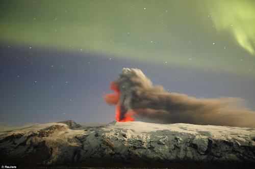 Northern Lights or Aurora Borealis - The visionary Lucia saw the northern lights in 1938, and shortly after World War II broke out. Now Reuters has released new photos of the northern lights or Aurora Borealis appearing against a new eruption of "that volcano" known as Eyjafjallajokull.