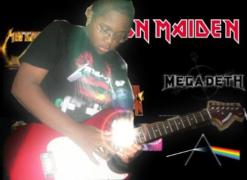 Me  - Dayum. I am sexy. Me with my guitar. And my favorite awesome bands put into the background to symbolize my love for them. \m/
