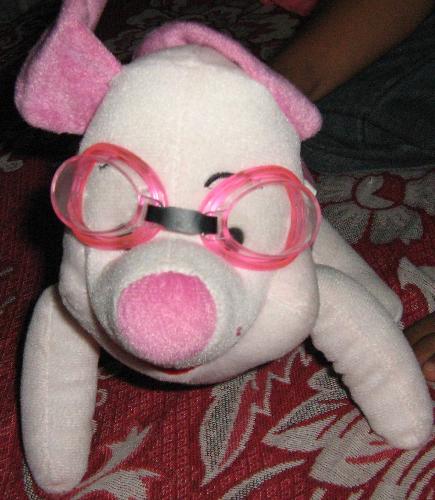 piglet - Piglet wearing pink swimming goggles.