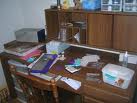 how will i clean this? - i have a problem in organizing my stuff, i would not want my desk to be so messy like this! help needed..badly.