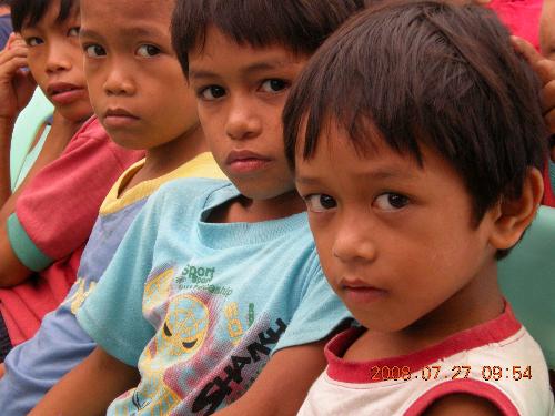 Classic Portrait - A photo of children taking interest on a nearby photographer.