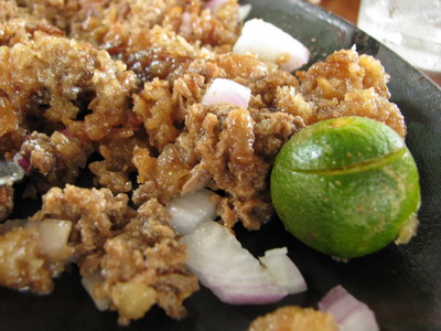 Dencio's Sisig - Sisig.. a Filipino dish made from parts of a pig’s head and liver, usually seasoned with calamansi (Philippine lemon) and chili peppers.