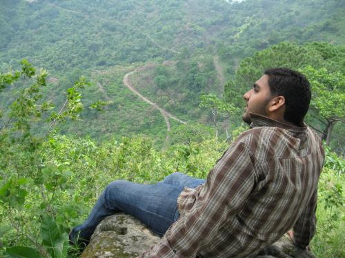 morni hills - me sitting on a stone near top of the mountain