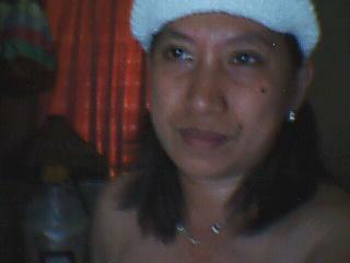 trying hard to look cute... - he he he he, sometimes its so good to feel so cute.   Anyway, this picture was taken inside my room. Alone, I am posing in front of my webcam. Kinda hard, because my moves are limited. But the most important is, I tried taking pictures for myself, I am camera shy when anyone else will do it for me.
