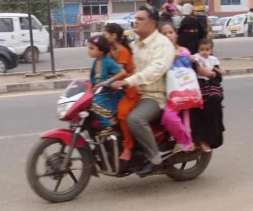 Motorcycle ride - A family of six members enjoying on a single motorcycle.