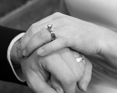 Marriage - A picture of hands of married couple with their wedding ring.