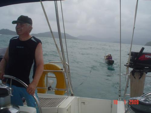 The captain´s cousin at the wheel - In this picture you can see the canoe and the cable while the captain´s cousin is at the helm. The storm can be seen from the colours of the sky and sea.