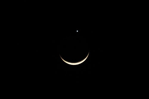 moon - this photo is courtesy of Yahoo. This spectacular event happen in the eve of May 16,2010 wherein the planet Venus is silently sitting on top of the Moon