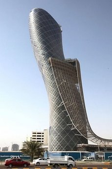 Leaning tower - Capital Gate Tower - Image from http://news.yahoo.com/nphotos/slideshow/photo//100606/photos_lf_afp/d814f93db6c026d335e1b6ded014dd21/#photoViewer=/100606/photos_lf_afp/d814f93db6c026d335e1b6ded014dd21

Capital Gate Tower in Abu Dhabi "furthest-leaning man-made tower" by Guinness World Records