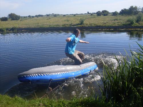 Jack using his kayak as a slide - My mad son using his kayak as a slide!