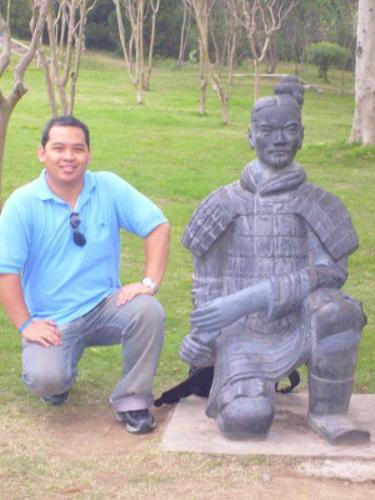 in china  - Beside a Terracota army general kneeling in front of the Dragon Emperor, China
