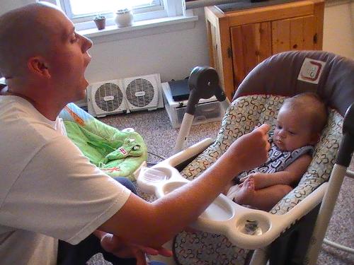 lol trying to get him to open wide - little man eating green beans for the first time he loved them