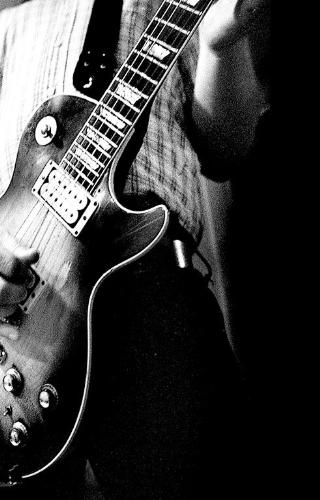 Mine - In this photo : Myself with a guitar edited with picasa.