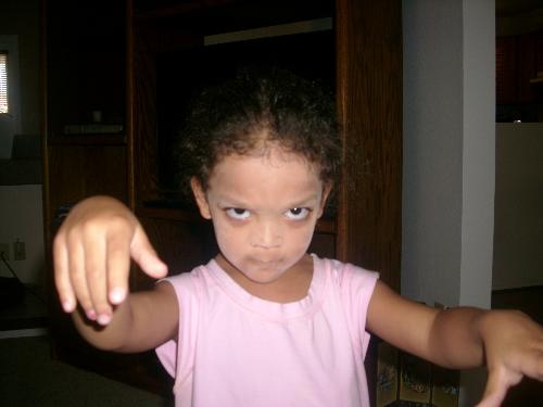 My Ghostly Granddaughter - This is a picture of my granddaughter acting like a ghost.