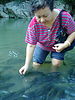 leg Massaging - Unique way of getting tired feet massaged by fishes in the river.