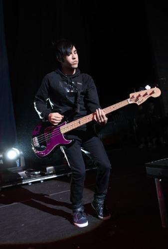 Pete Wentz New Bass - This is Pete Wentz's new bass. He is the bass guitarist of Fall Out Boy. This bass is purple and black. It was originally made in a small scale for his son, Bronx Mowgli Wentz, who was born November 20th, 2008. Their is purple where the red coloring normally is. He used this bass in the later part of 2009. It can be seen from footage of the Leeds Festival.