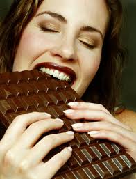Chocolate - woman eating chocolate
