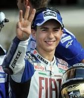 Jorge Lorenzo signalling another victory - celebration after winning the race