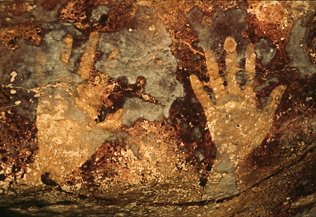 Hand stencils in prehistoric cave paintings - Stencilled images of hands in a prehistoric cave painting.
