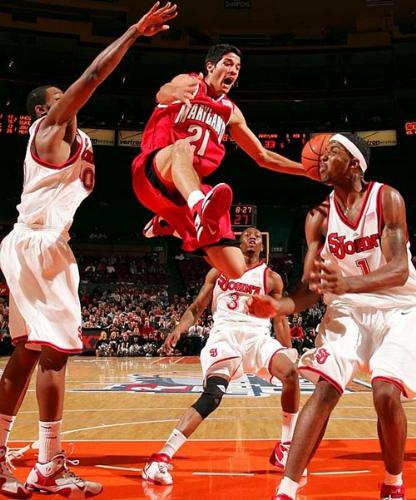 An NBA game in Progress - This photo depicts the heat, the involvement, in Basketball, which is a major sporting industry today.